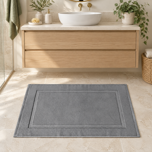 Bath Mat Jarmila in grey in front of an oak vanity