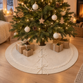 Tree Skirt Marcela, cream cable knit tree skirt under a christmas tree