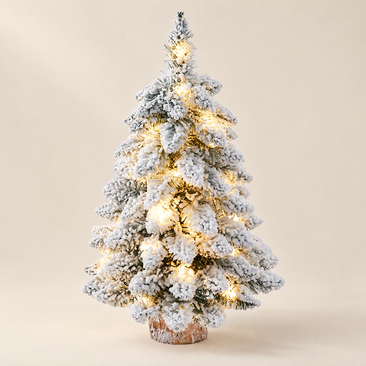 Tabletop Tree Janka – snowy mini Christmas tree with lights, studio shot