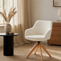 Armchair Karol - cream ribbed velvet swivel armchair in a warm living room corner