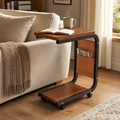 Side Table Igor rolling side table with wood top and storage pouch beside a sofa in a living room