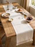 Table Runner Timotej, ivory linen runner with fringe, styled on a sunlit rustic dining table set for breakfast