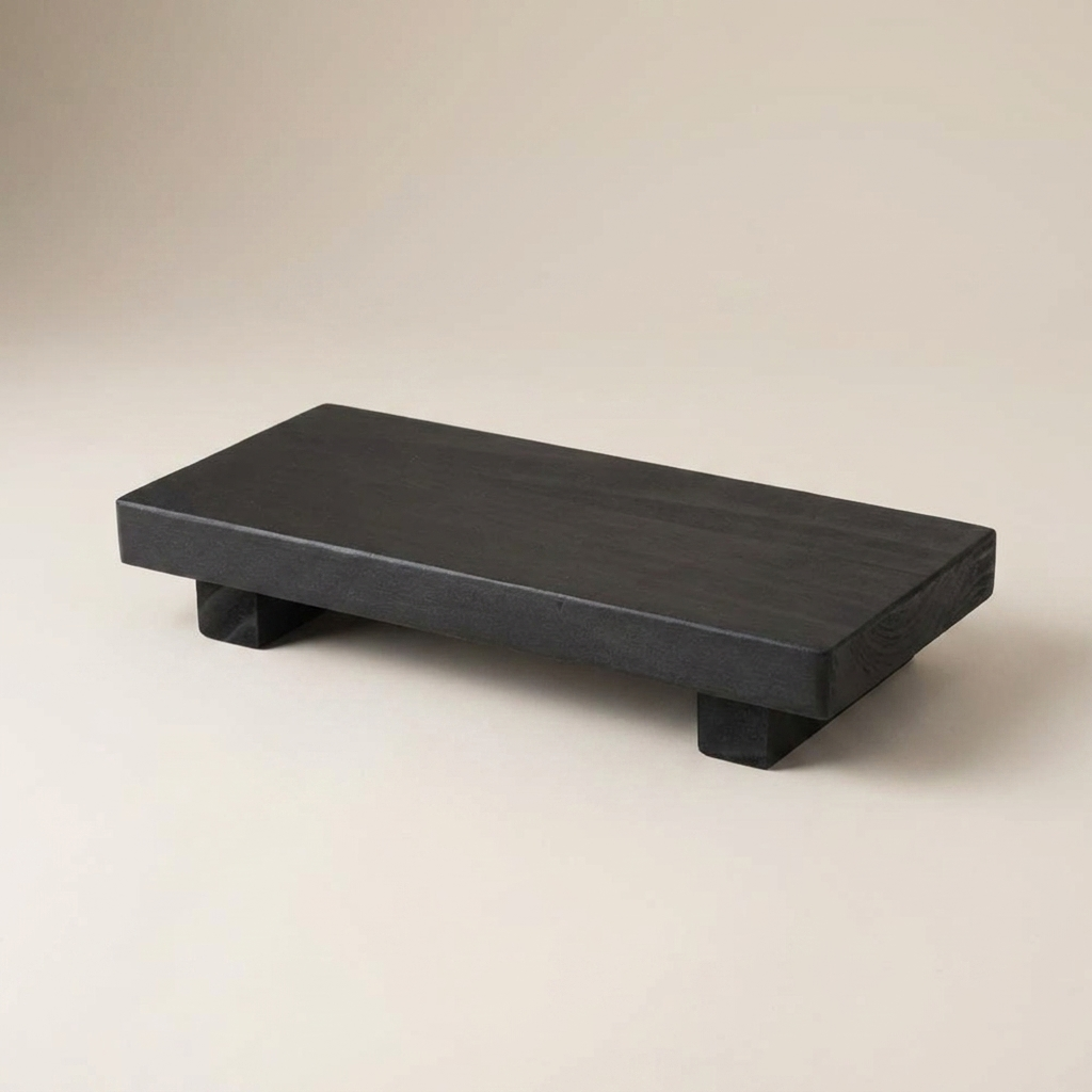 Pedestal Riser Katarína in Black, footed wooden riser on a neutral background