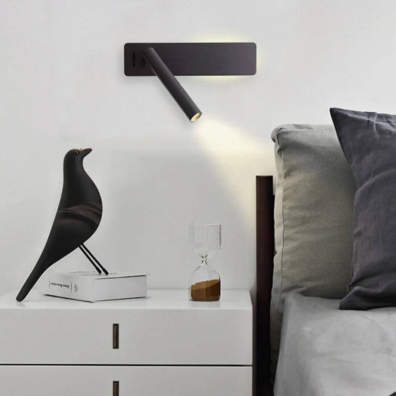 Wall Lamp Monika in black beside a bed