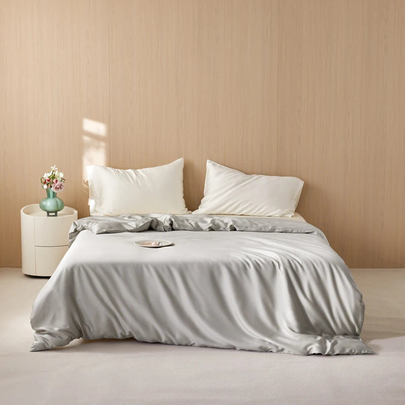 Duvet Cover Terézia in silver grey on a bed with white pillows