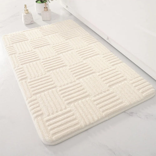 Bath Mat Silvia in cream with a raised woven pattern
