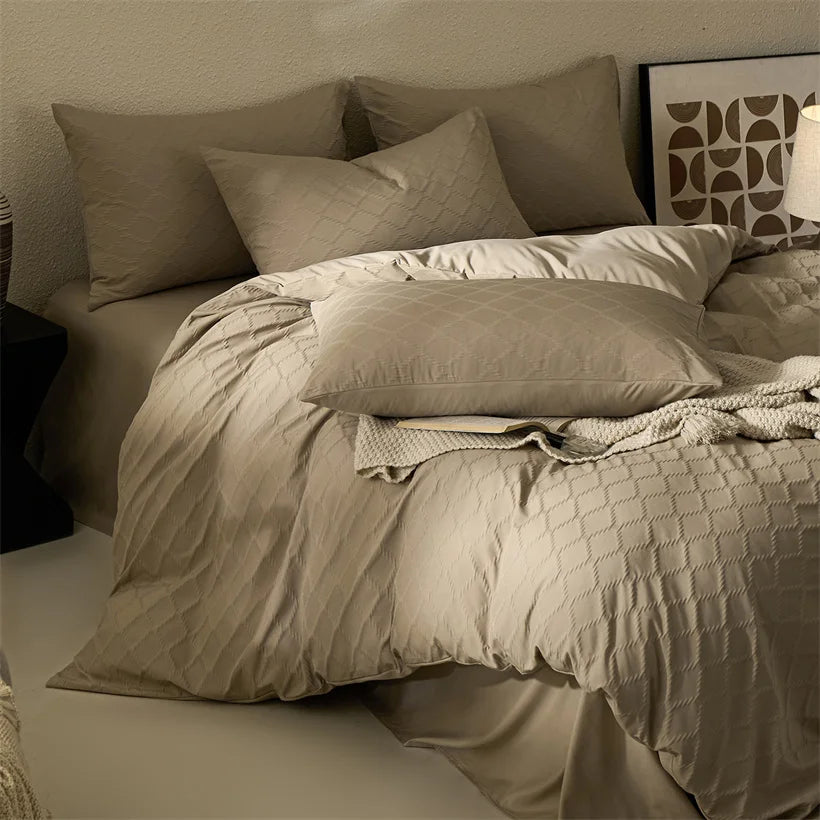 Duvet Cover Set Marta in taupe jacquard on a bed