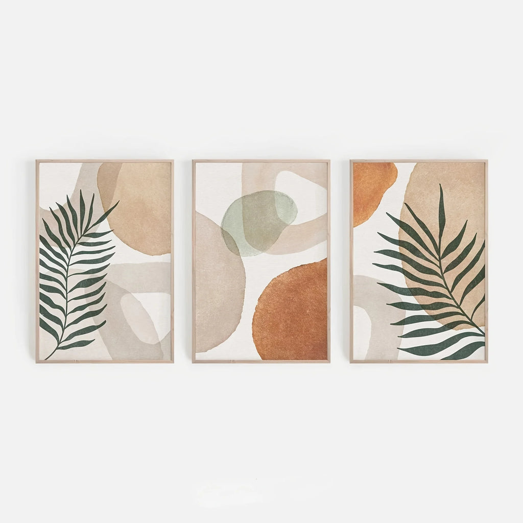 Set of three leaf and terracotta art prints, shown framed for illustration