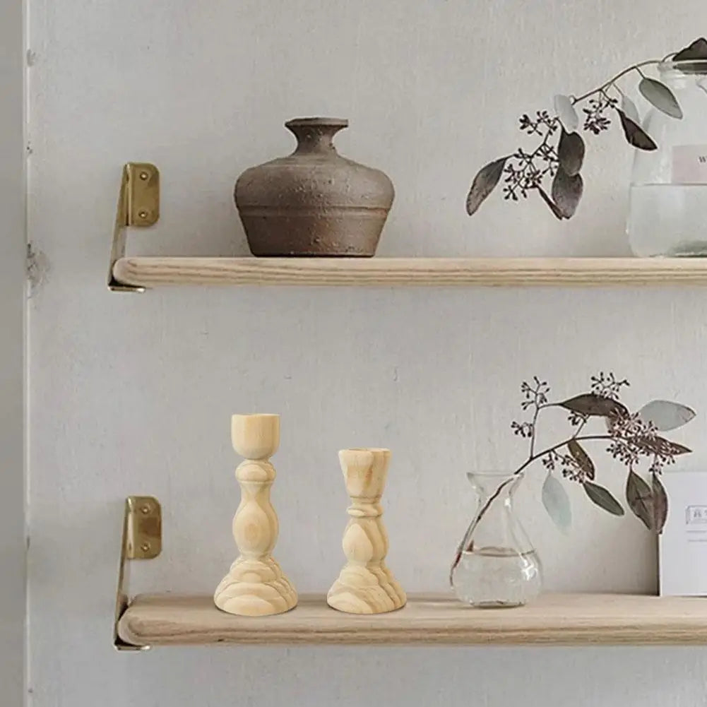 Candlesticks Tomáš in natural wood on a shelf