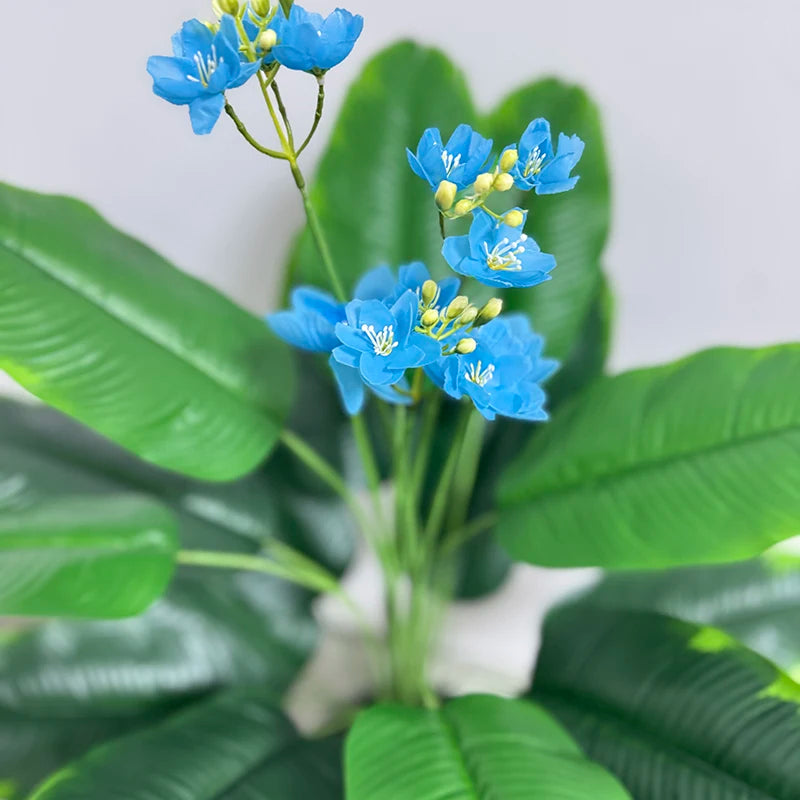 Close-up of the soft blue blossoms and green leaves