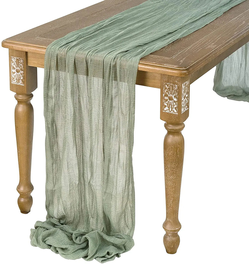 Sage gauze table runner on a wooden console table