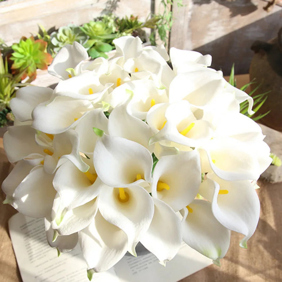 White real-touch calla lilies in a loose bunch