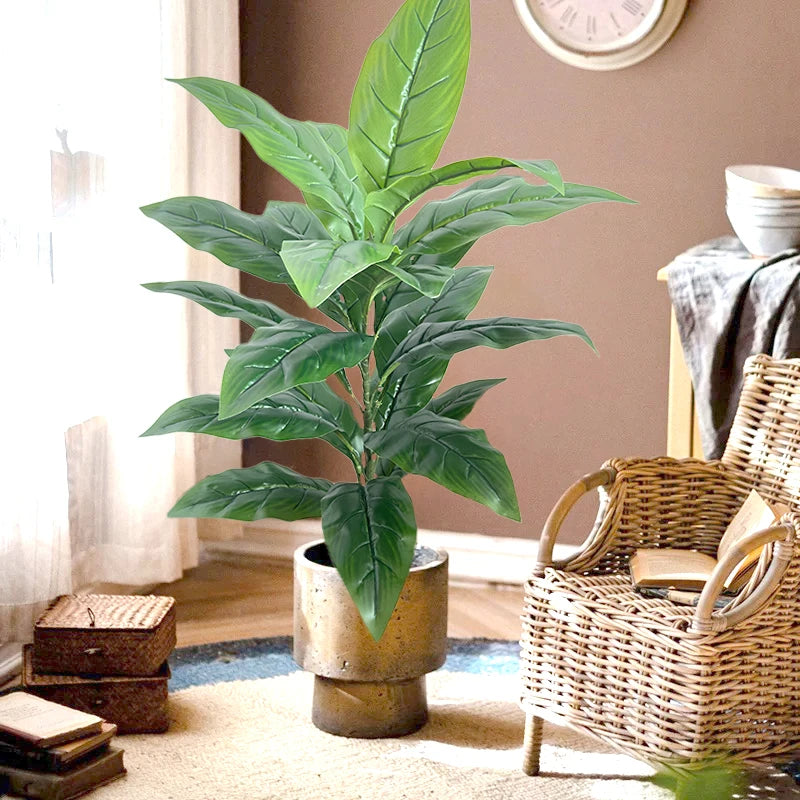 Artificial plant Andrea in a woven basket on a rug