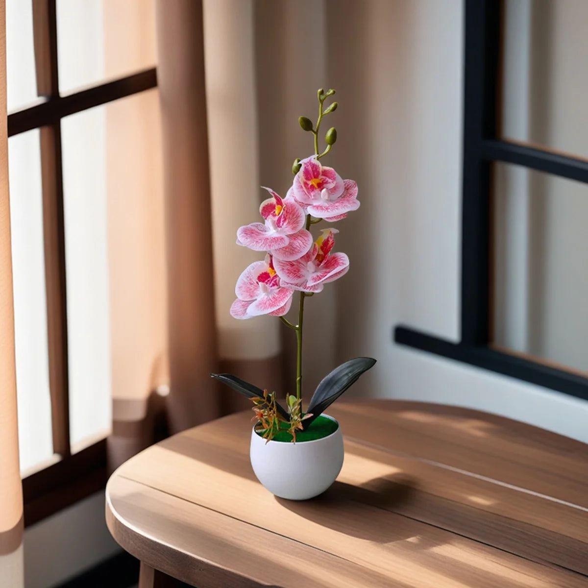 Artificial pink veined orchid in a white pot