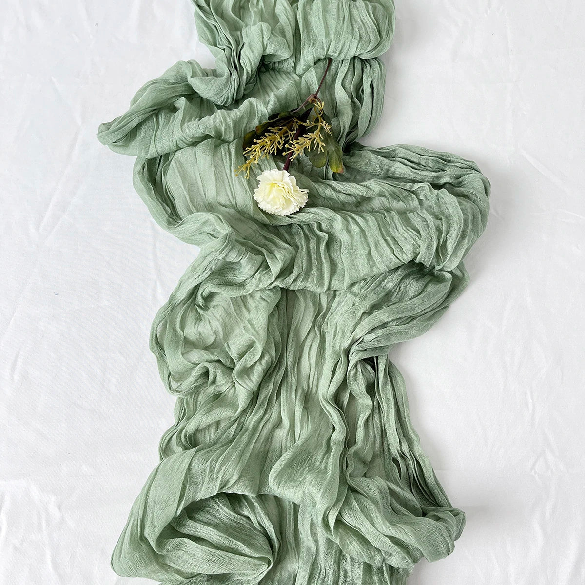 Sage semi-sheer gauze table runner, crinkled texture