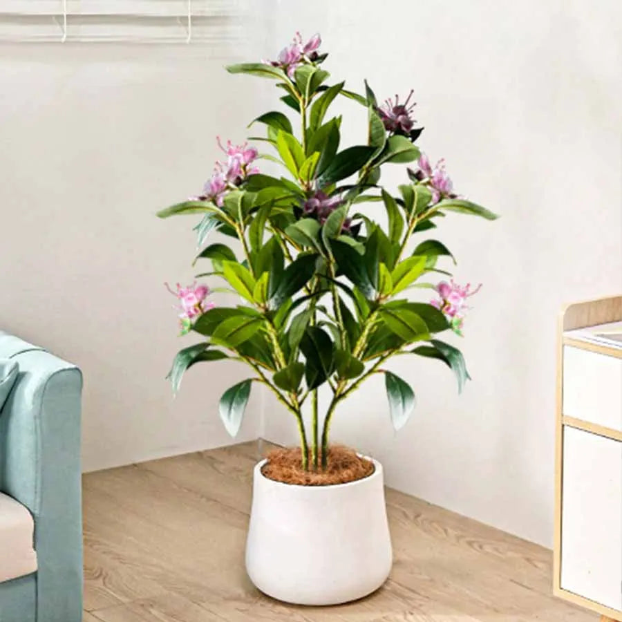 Faux flowering stem Denisa with pink blossoms in a white planter