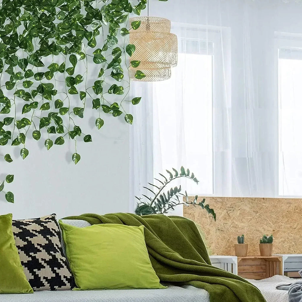 Faux ivy strands hanging above a sofa in a bright living room