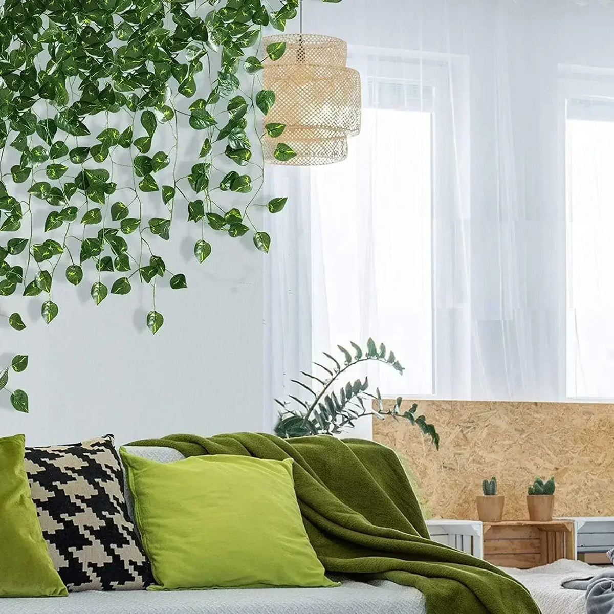 Faux ivy strands hanging above a sofa in a bright living room