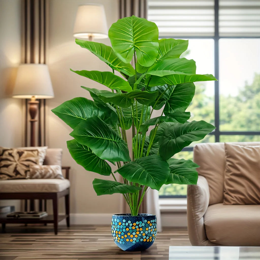 Faux tropical plant with 18 large green leaves in a decorative pot (pot not included)