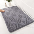Bath Mat Silvia in dark grey with a raised woven pattern