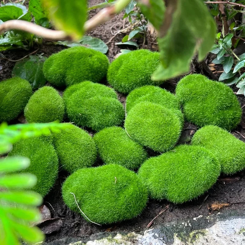 Many soft green faux moss rocks arranged together