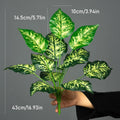 Speckled leaf faux plant held in hand with size measurements
