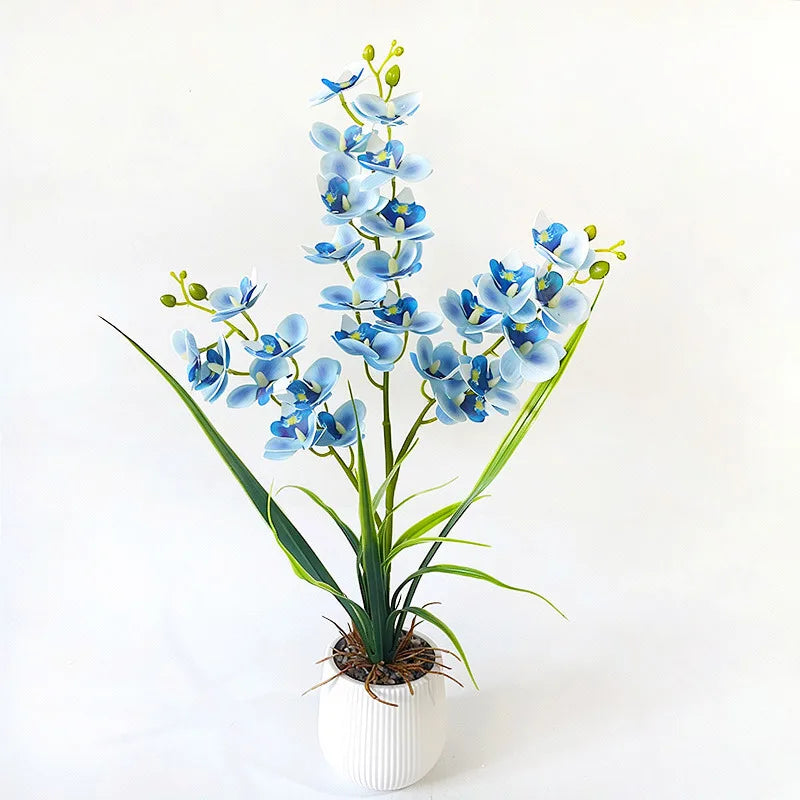 Artificial blue orchid in a white ribbed pot