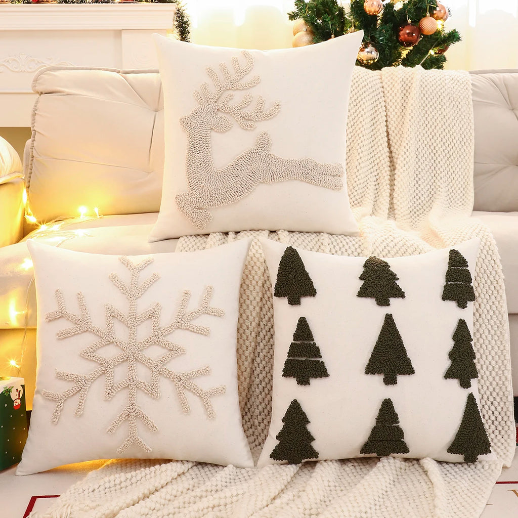 Cushion Cover Yvetta reindeer, snowflake and tree covers on a cosy Christmas sofa