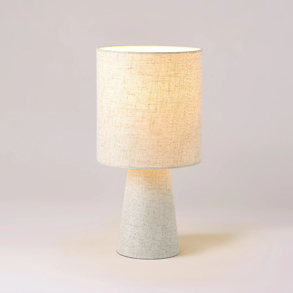 Table Lamp Marek on a plain background showing the linen shade and tapered base
