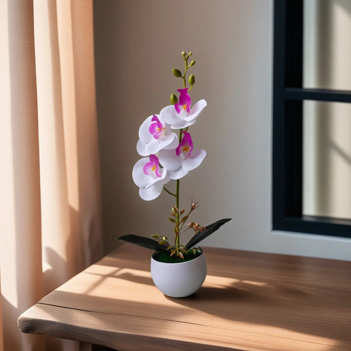 Artificial white orchid with pink centre in a white pot