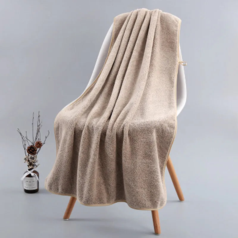 Bath Towel Gregor in Khaki draped on a chair