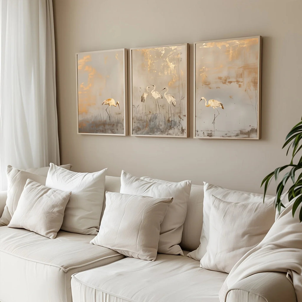 Wall Art Ingrida – crane prints above a cream sofa