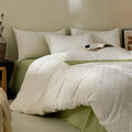 Duvet Cover Set Marta in ivory on a bed