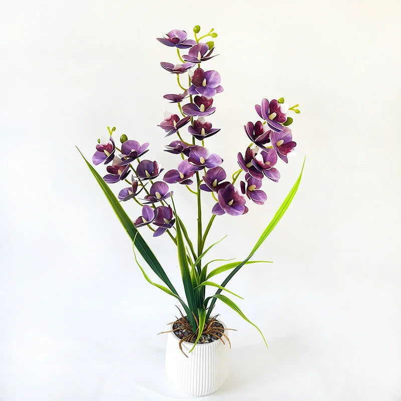 Artificial purple orchid in a white ribbed pot