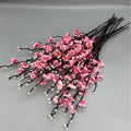 Bunch of pink faux plum blossom stems