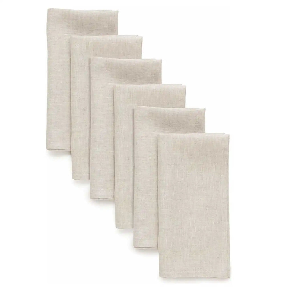 Set of six natural cloth napkins standing in a row