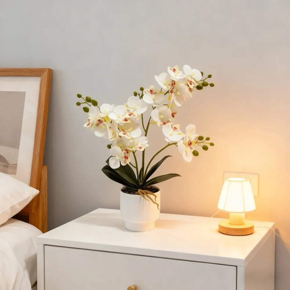 Artificial white butterfly orchid in a ribbed white pot