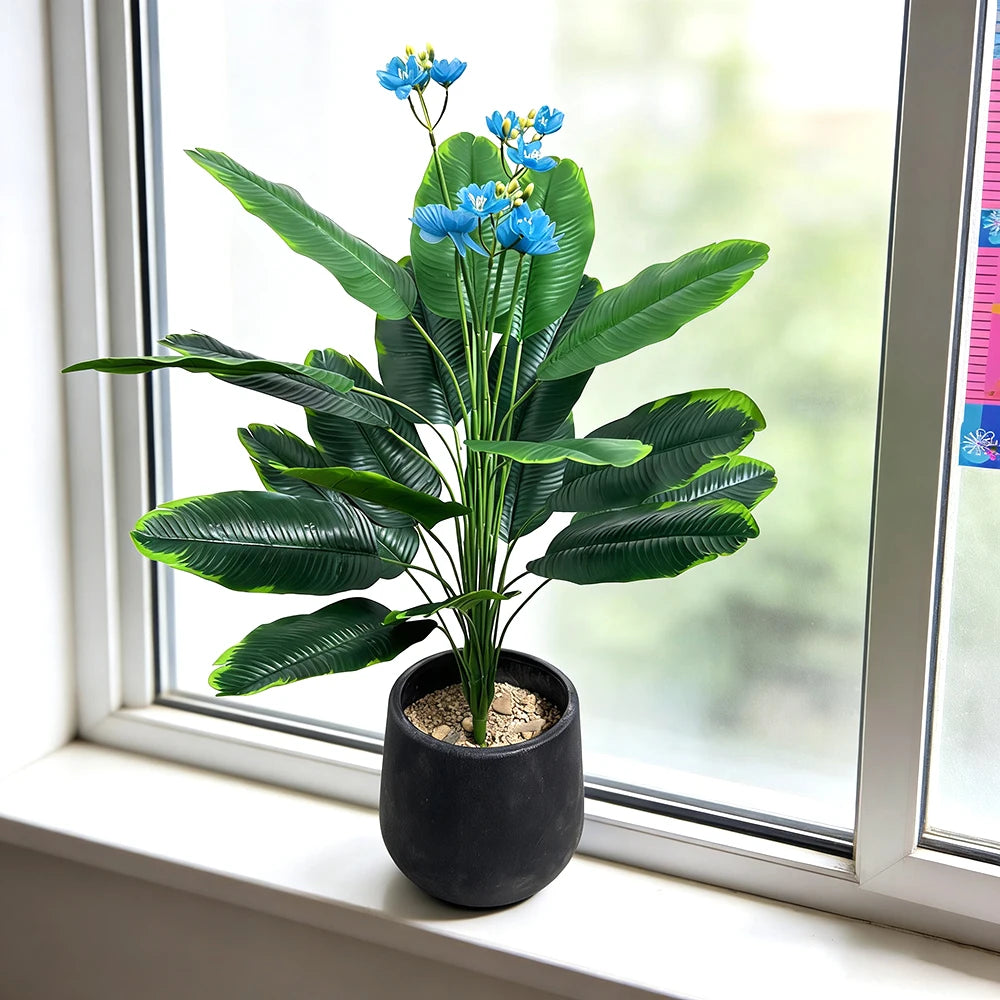 Artificial plant Albína on a windowsill in a black pot