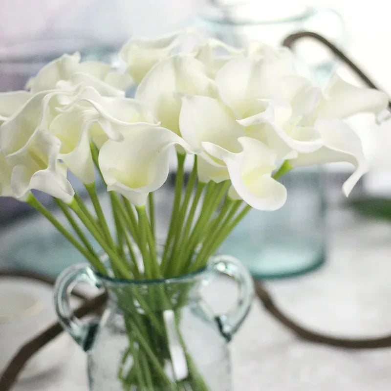 White calla lilies in a glass jar