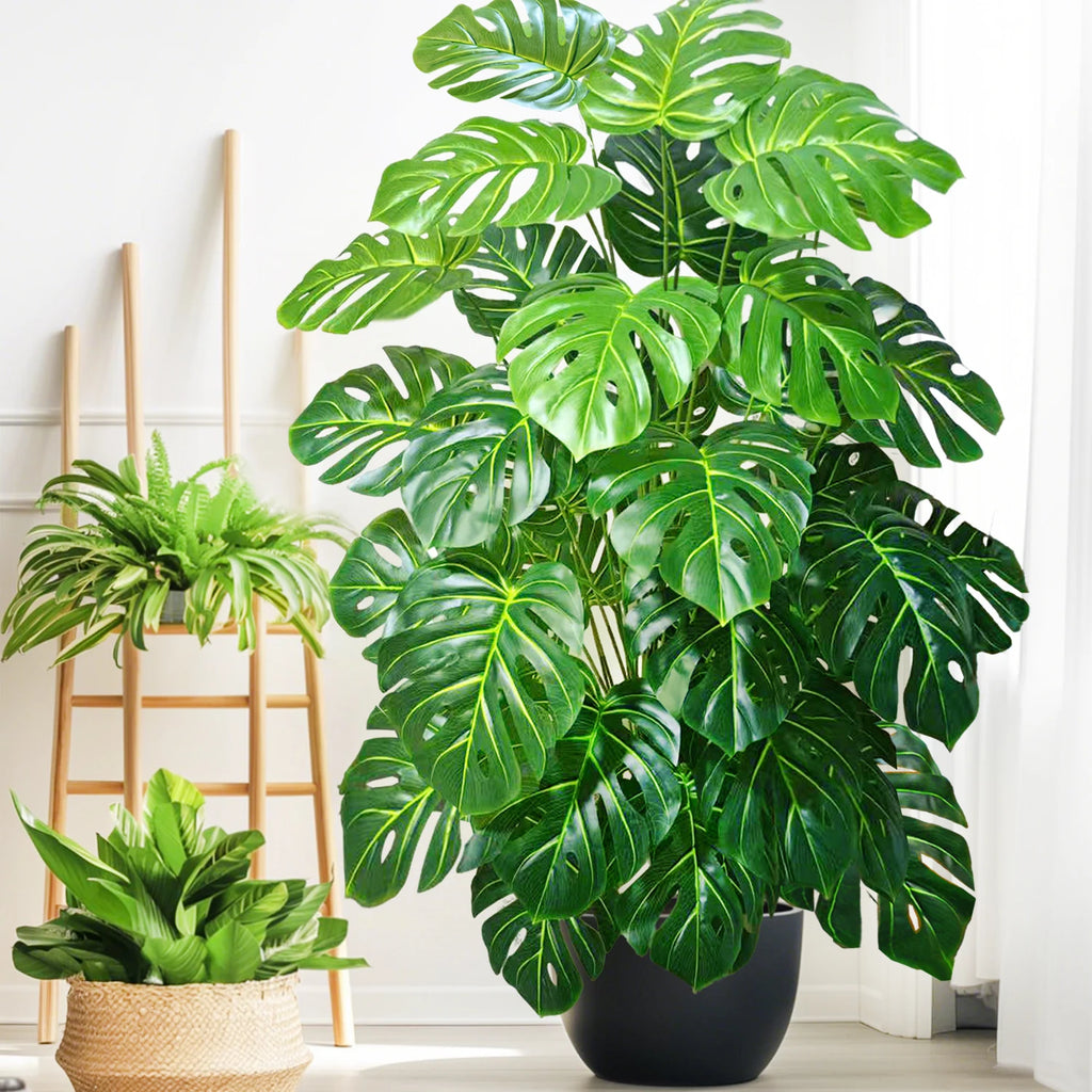 Artificial monstera Blanka in dark green with a black pot