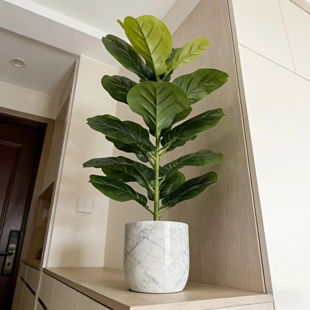 Faux fiddle-leaf fig in a marble-look pot beside a hallway door
