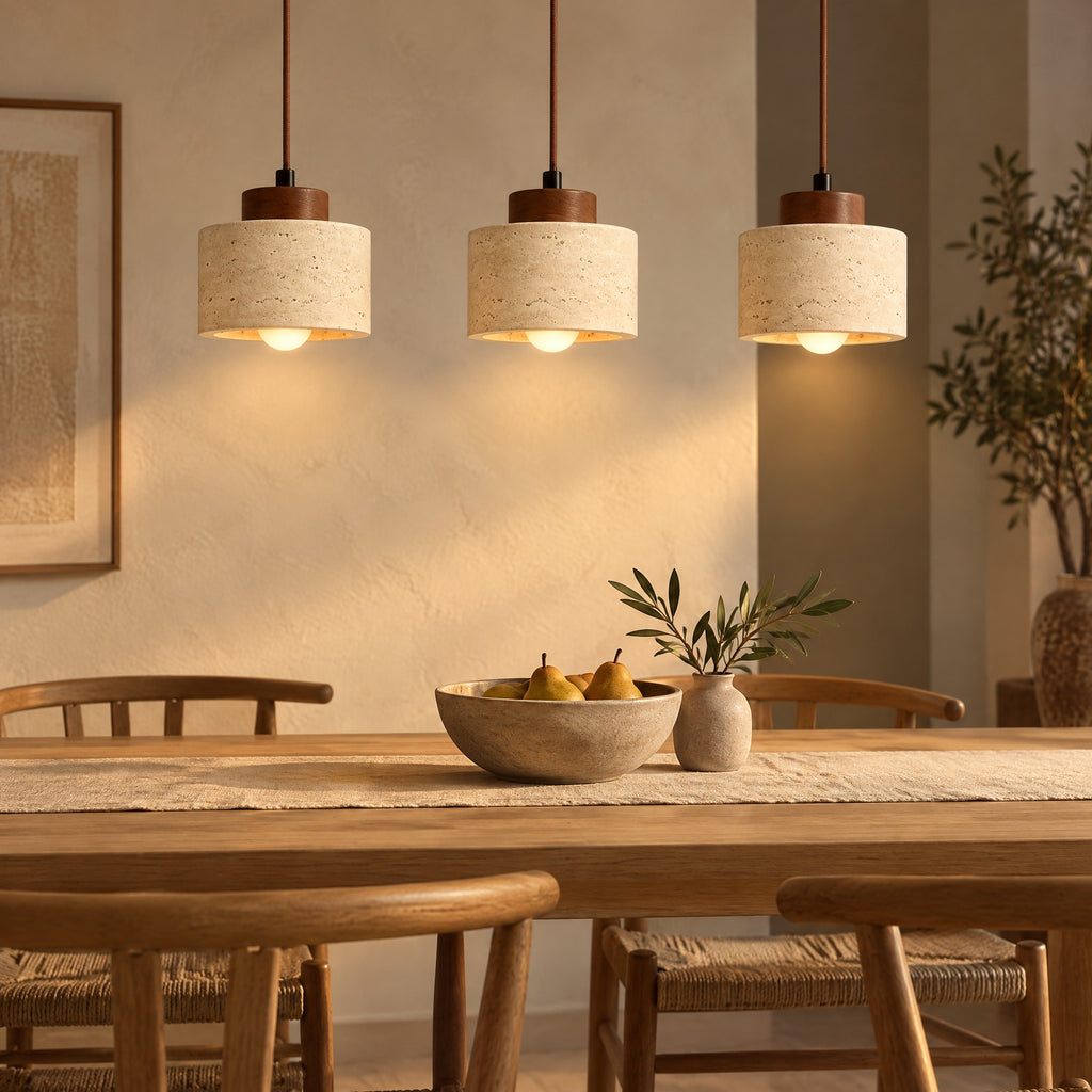 Three Pendant Light Dana travertine pendants above a dining table