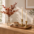 First Home Gift Set styled on a console with a glass vase, stone bowl, and brass candlestick holders
