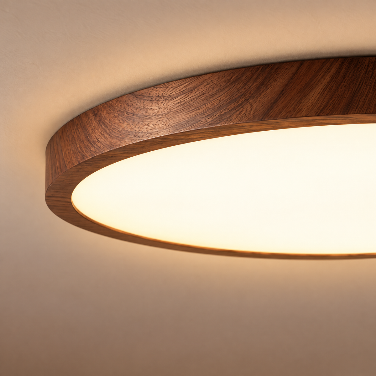 Close-up of Ceiling Light Marián's walnut wood-grain edge and softly glowing center