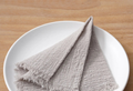 Cloth Napkins Iveta in Silver Grey folded on a plate