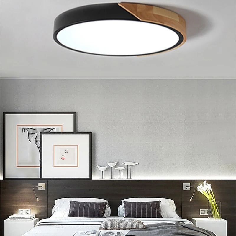 Ceiling Light Juraj in black above a bed
