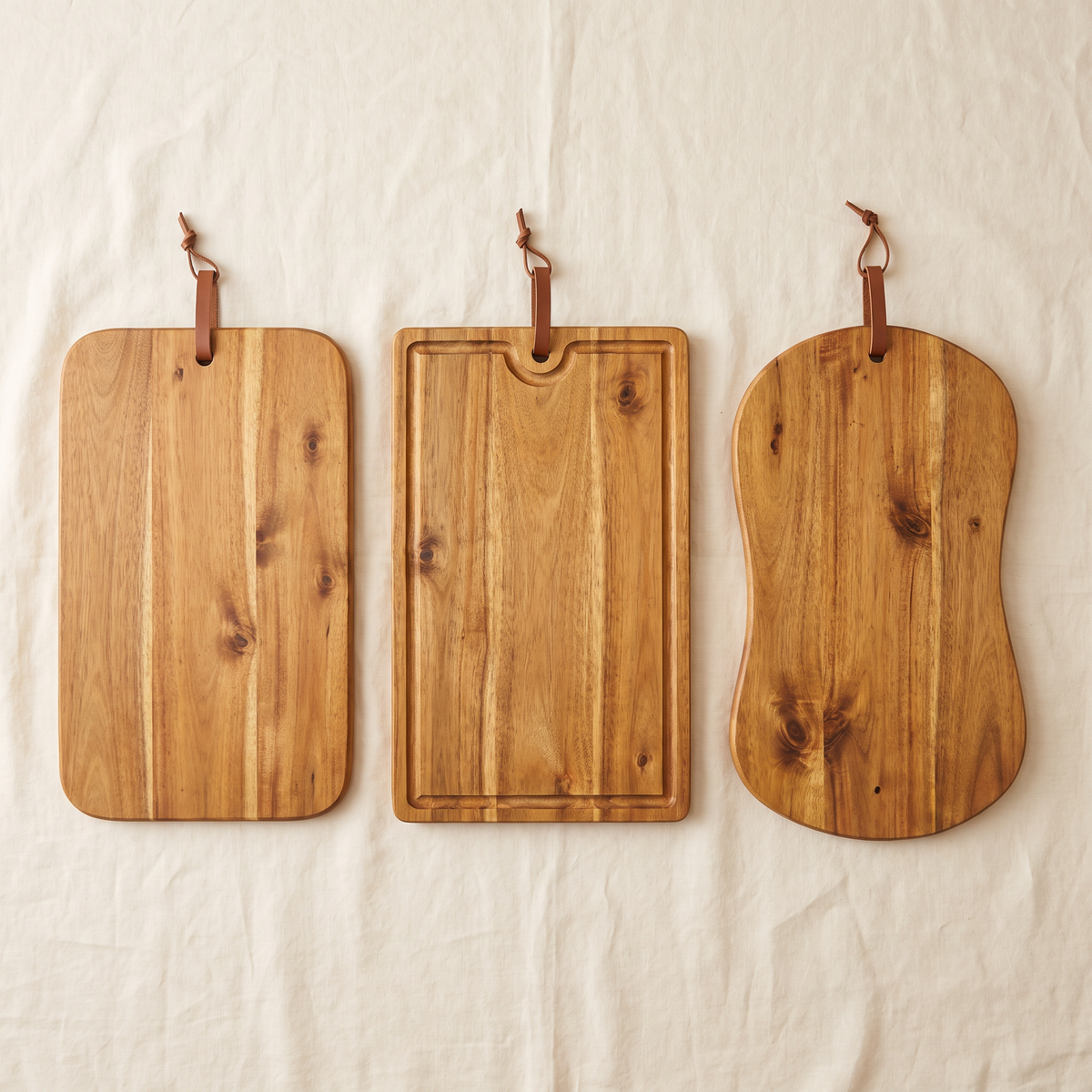 Cutting Board Leo in all three styles: Classic Rectangle, Grooved Rectangle, and Organic Curve