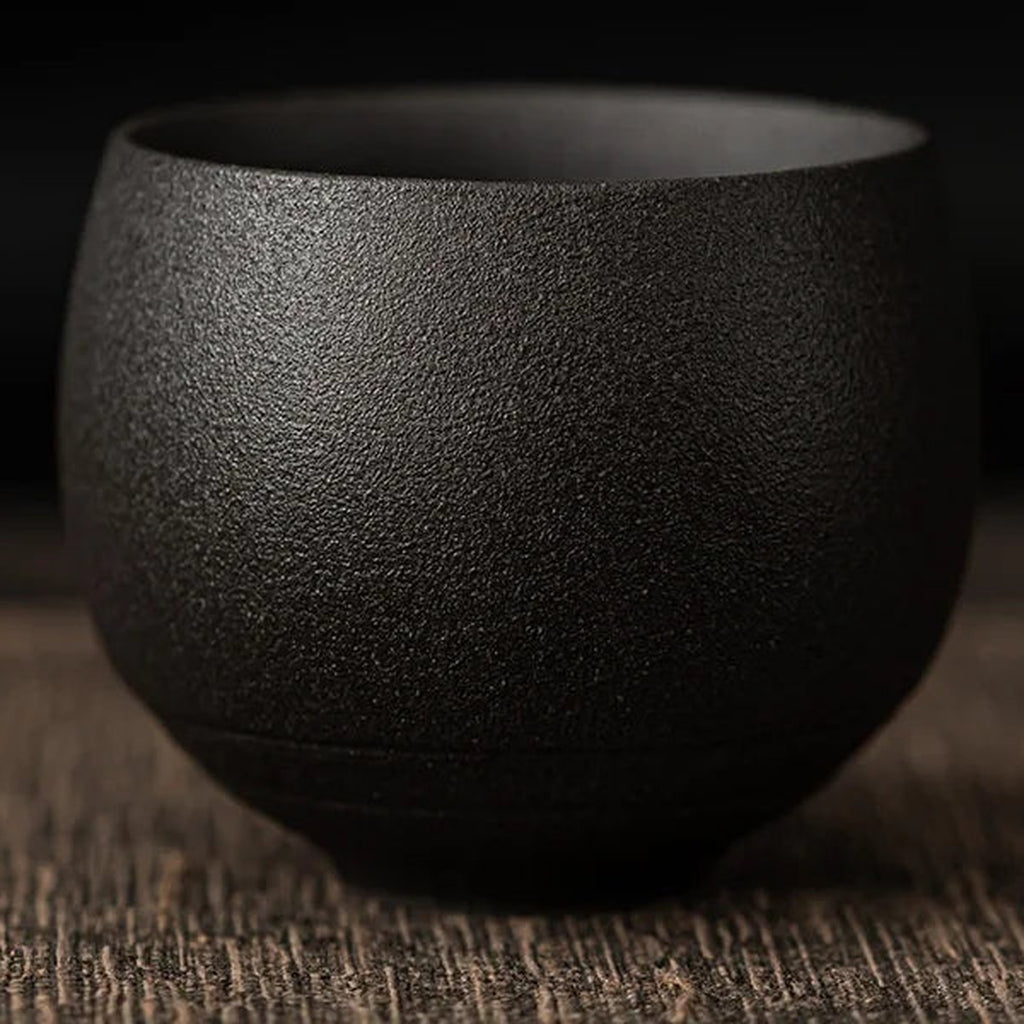 Tea Cup Mária in charcoal, a matte black round stoneware cup