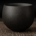 Tea Cup Mária in charcoal, a matte black round stoneware cup