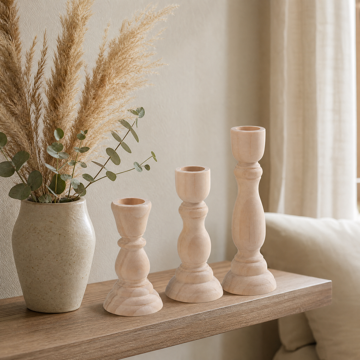 Beechwood candlesticks styled on a shelf with dried pampas grass and eucalyptus in a warm wabi-sabi living room
